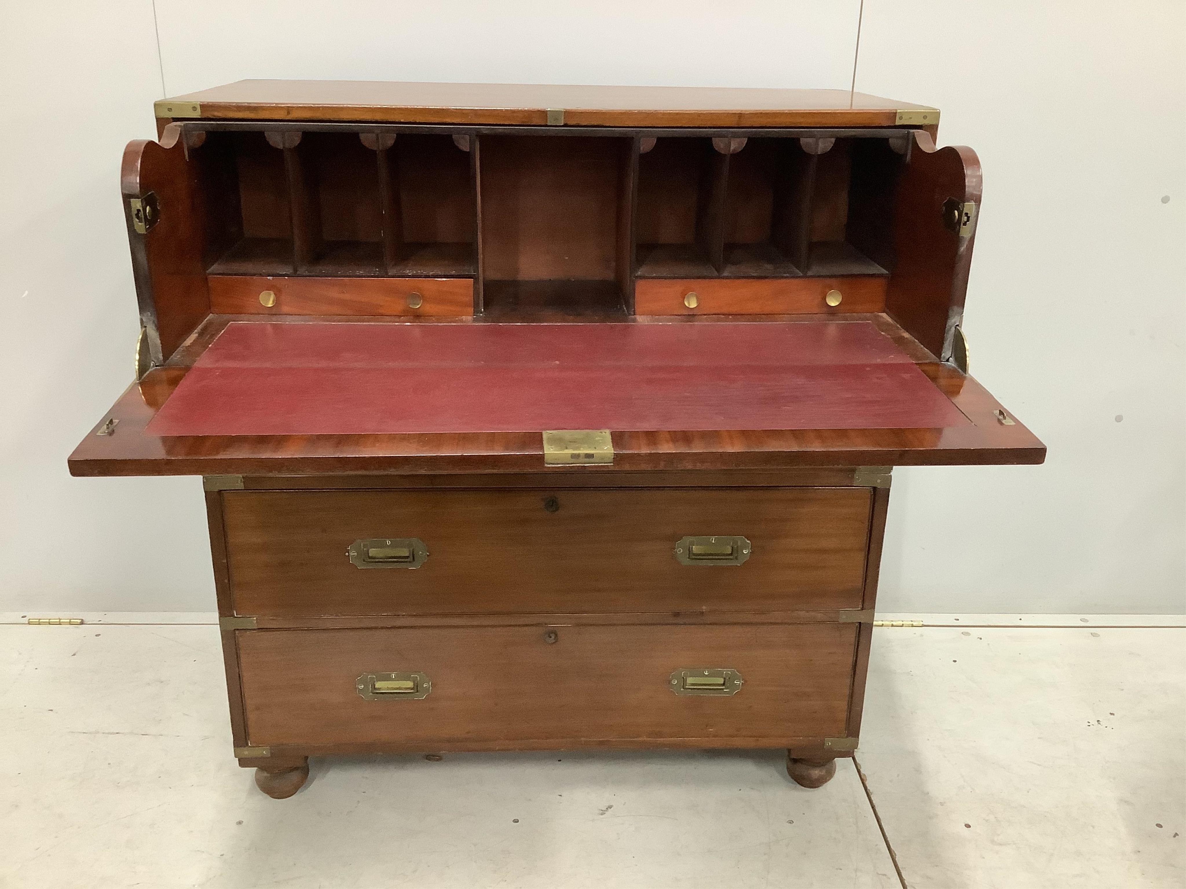 A Victorian brass mounted mahogany two part secretaire military chest with later pigeonhole interior, width 98cm, depth 47cm, height 109cm. Condition - fair, lacking all escutcheons